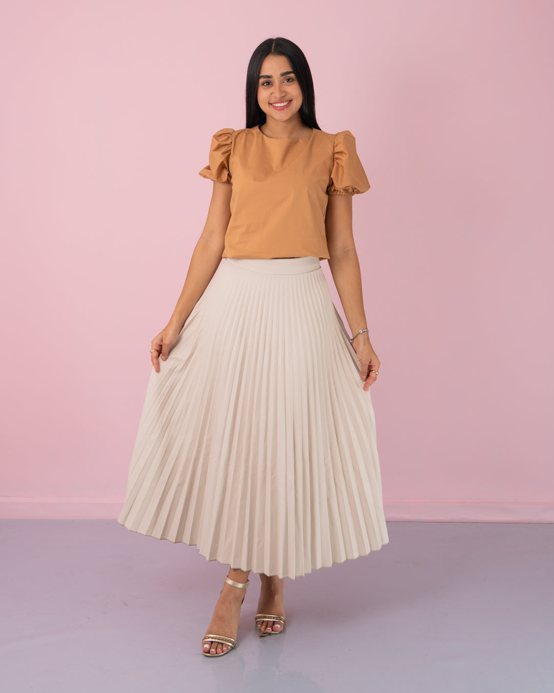FALDA PLIZADA TELA CUERINA
